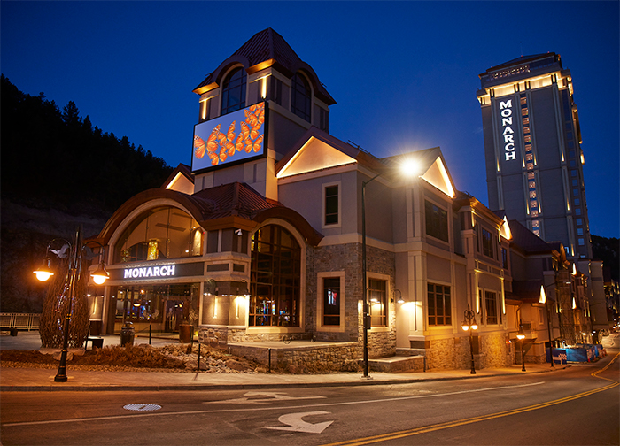 An evening view of the grand entrance to Monarch Casino Resort Spa in Black Hawk, Colorado.